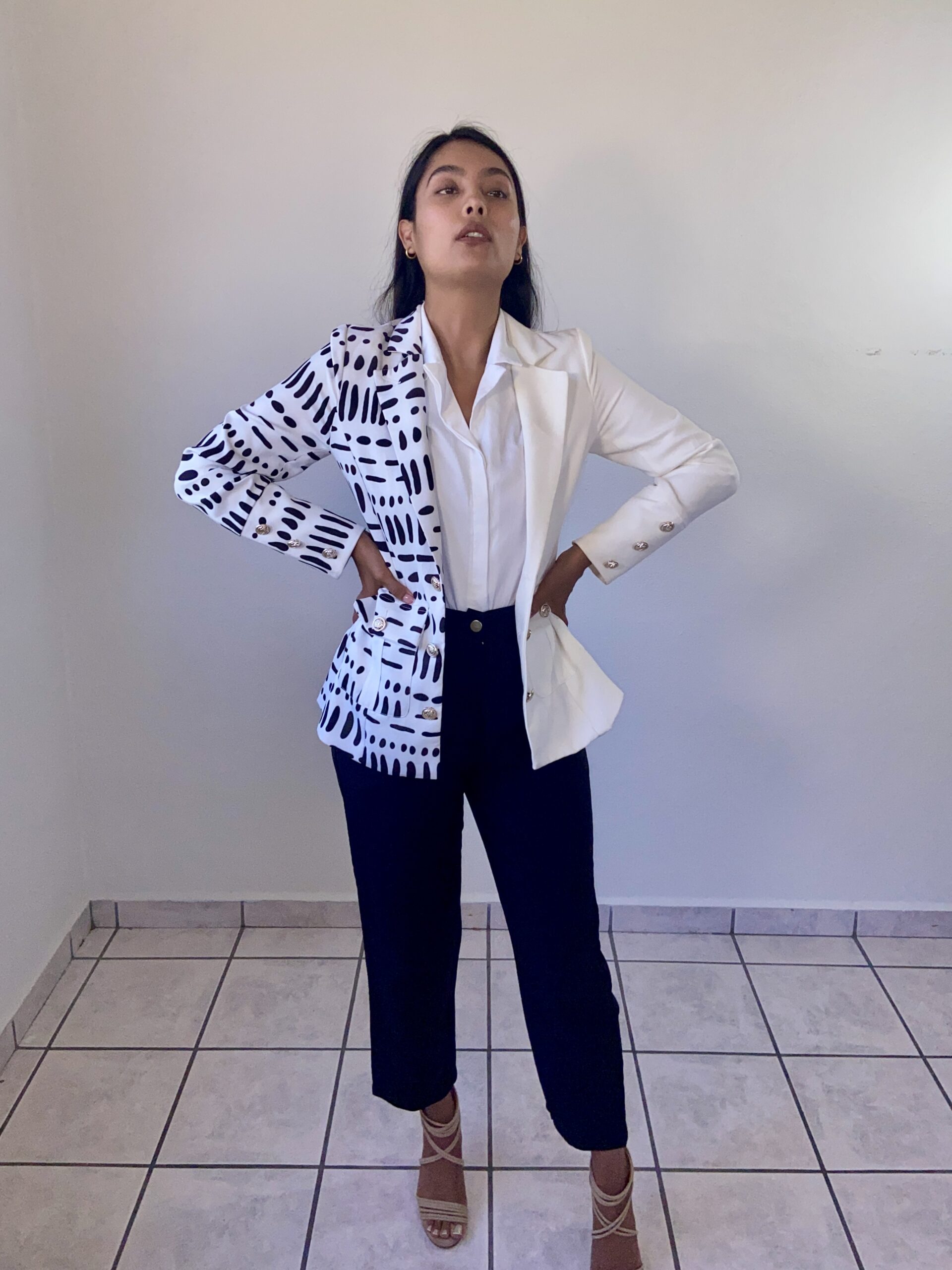 model Karina Araujo in a white and black professional suit for women